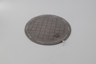 Fox and geese board game on a round gray leather playing field